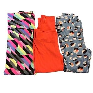 3 pairs of Medium athletic leggings - Victoria’s Secret, Gottex and O’Neill